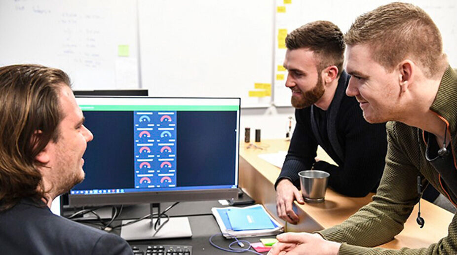 sensade team looking at the first parking prototypes