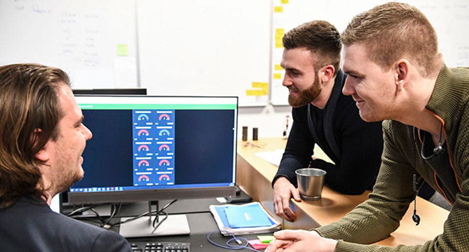 sensade team looking at the first parking prototypes